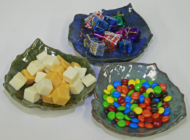 Wonderful display of Go Green small Leaf Bowls by Atelier de Teresa